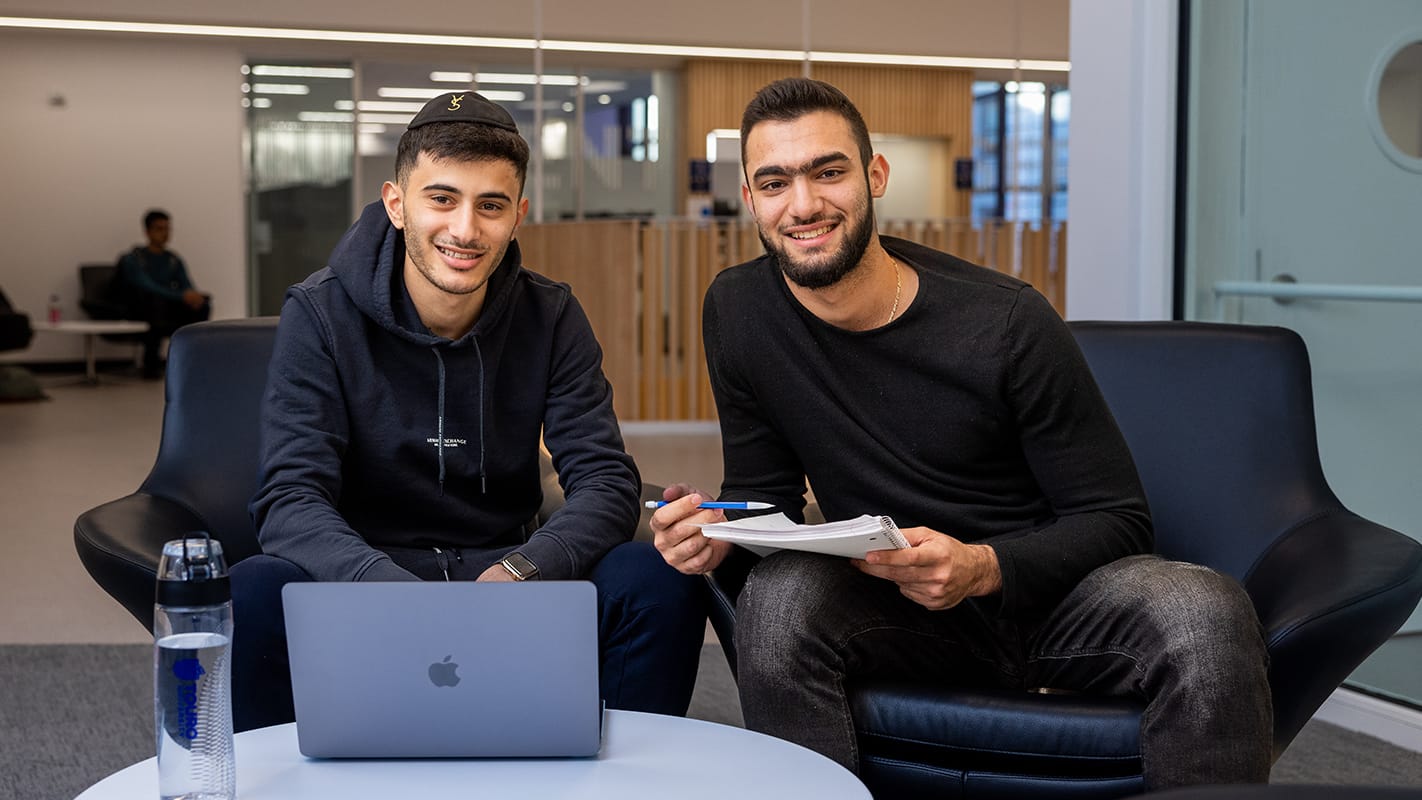 two students smiling